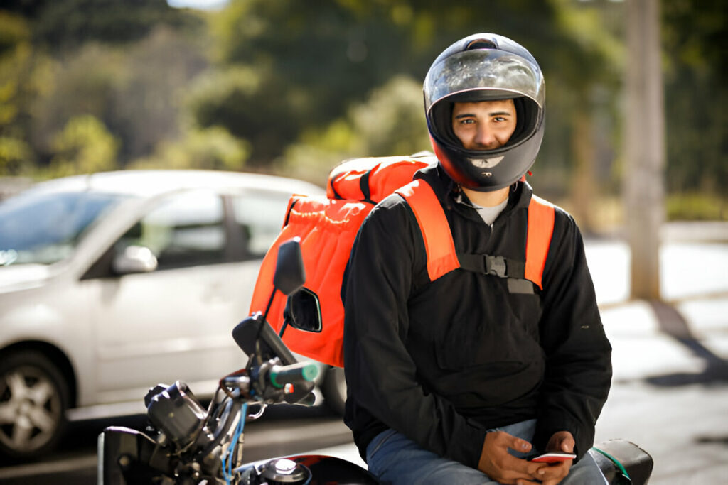 delivery guy sitting on motorcycle